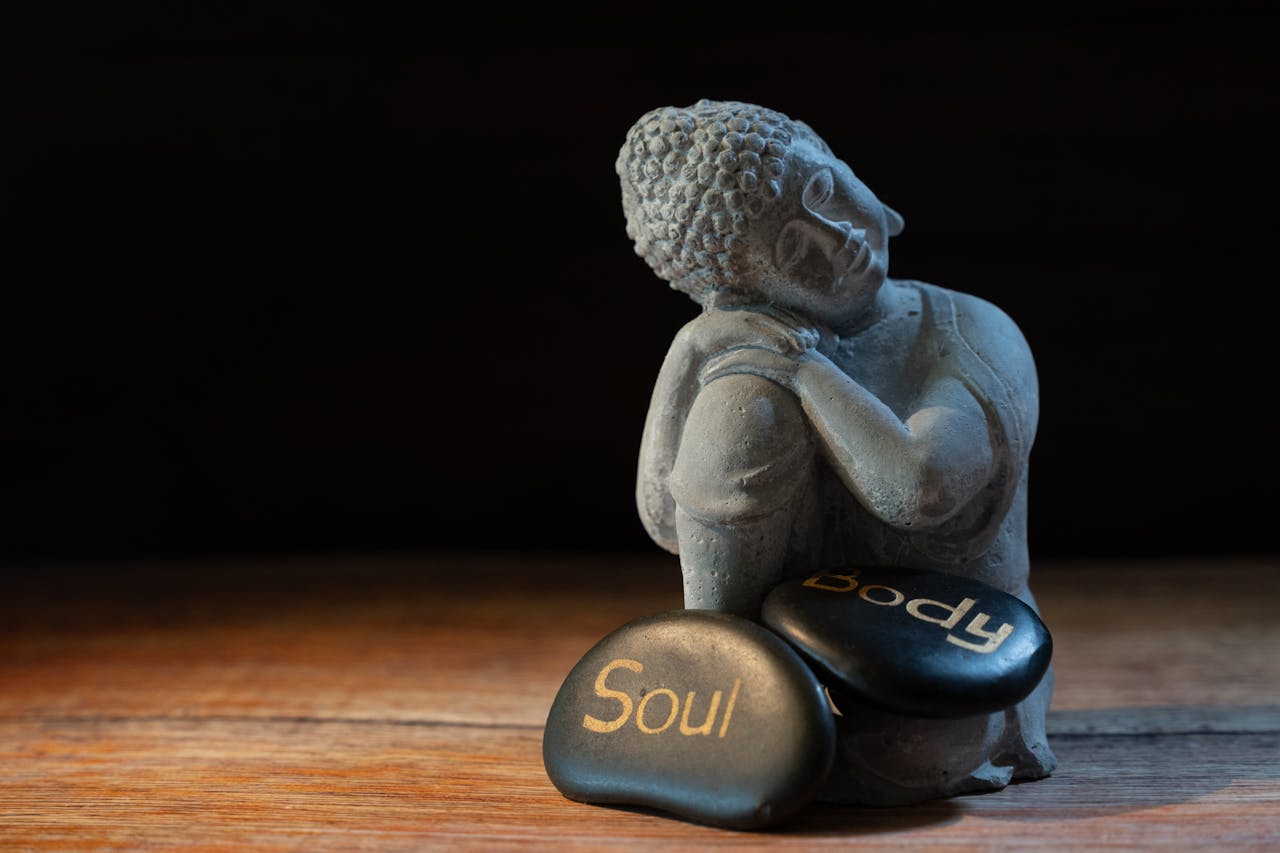 Mastering the First Impression: Your intriguing post title goes here Buddha statue with stones labeled Soul and Body, symbolizing mindfulness and balance.
